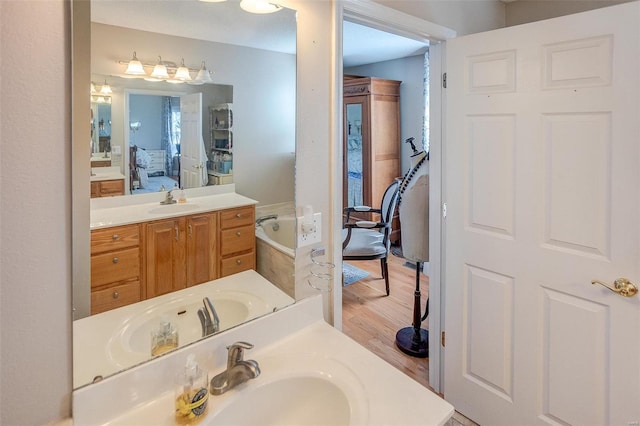 bathroom featuring hardwood / wood-style floors and vanity