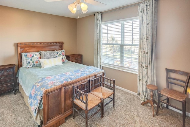 bedroom featuring light carpet and ceiling fan