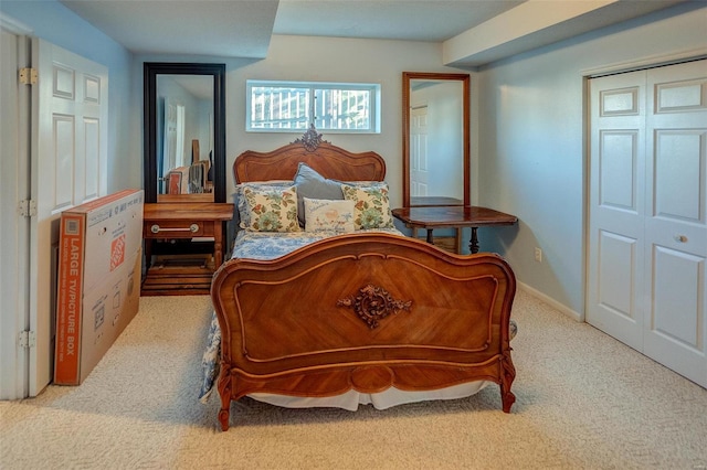 carpeted bedroom with a closet