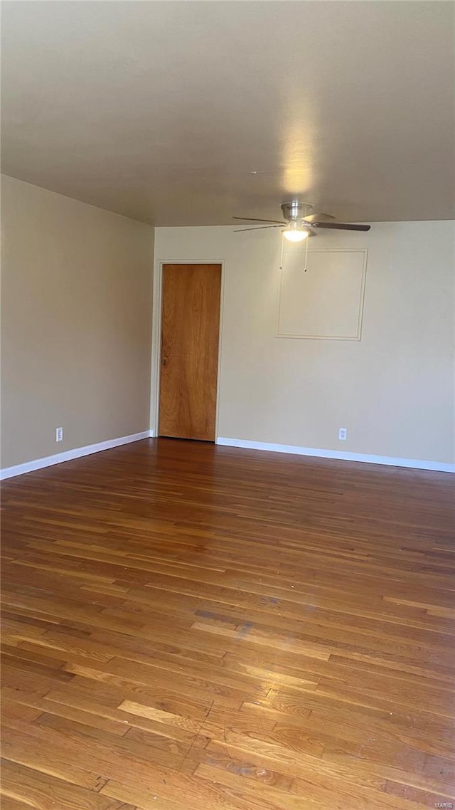 unfurnished room with hardwood / wood-style floors and ceiling fan