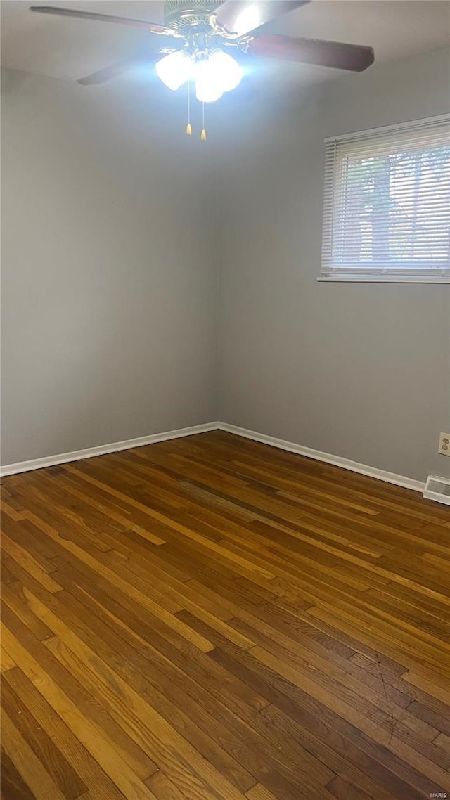 spare room featuring dark hardwood / wood-style floors