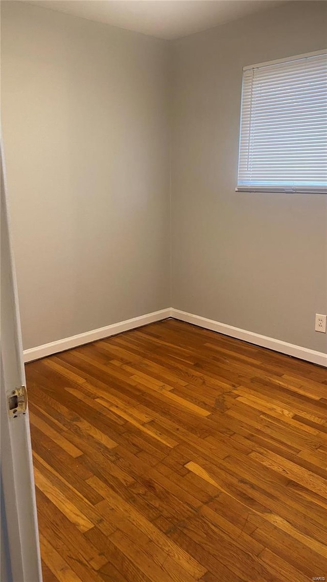 unfurnished room featuring hardwood / wood-style floors