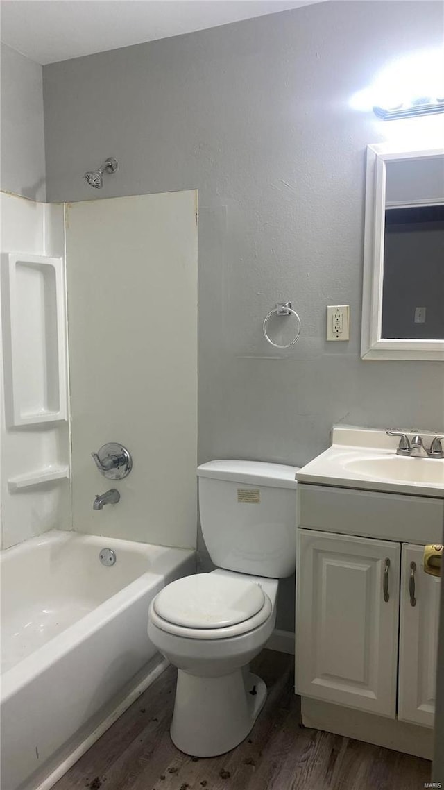 full bathroom featuring toilet, vanity, shower / bath combination, and hardwood / wood-style flooring