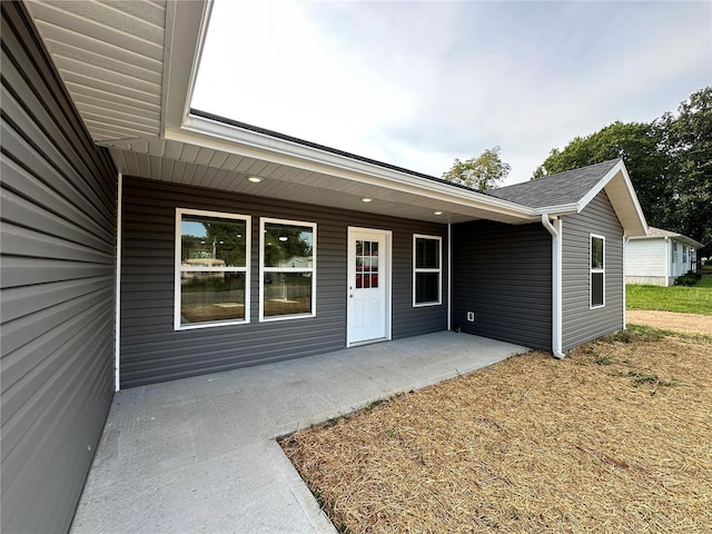 property entrance with a patio area