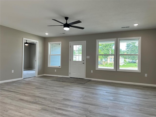 interior space featuring ceiling fan and light hardwood / wood-style flooring