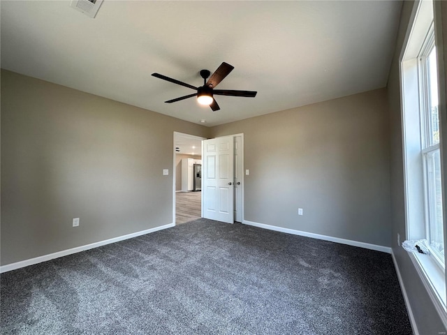 unfurnished bedroom with carpet flooring and ceiling fan