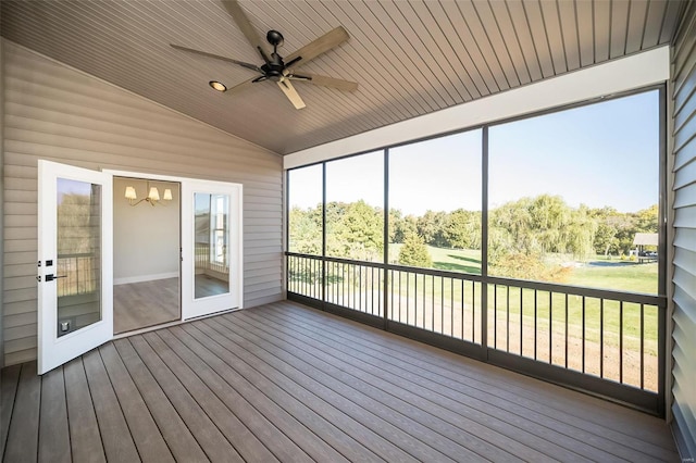 unfurnished sunroom featuring french doors, lofted ceiling, ceiling fan, and wooden ceiling