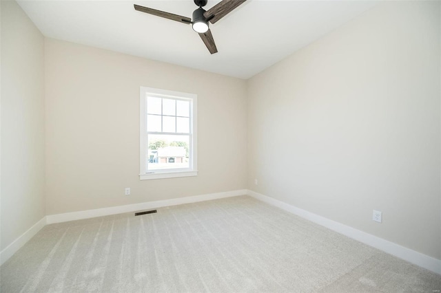 unfurnished room featuring ceiling fan and light colored carpet