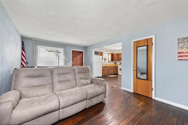 living room with dark hardwood / wood-style floors