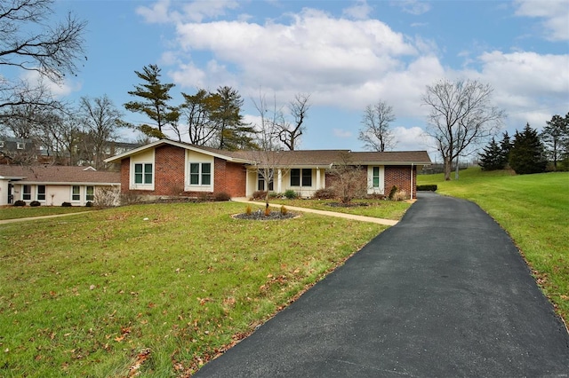 ranch-style house with a front lawn