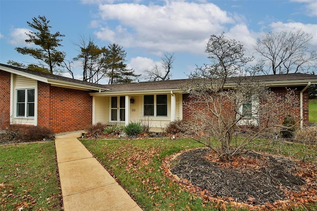 ranch-style home featuring a front yard