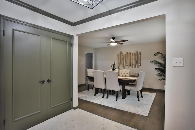 dining room with dark hardwood / wood-style flooring and ceiling fan