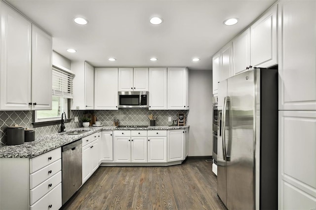 kitchen with white cabinetry, sink, and appliances with stainless steel finishes