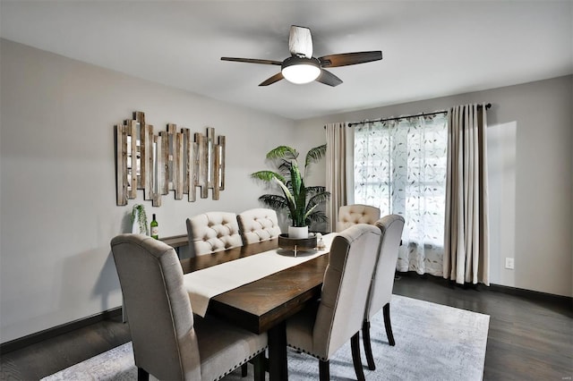 dining area with dark hardwood / wood-style flooring and ceiling fan