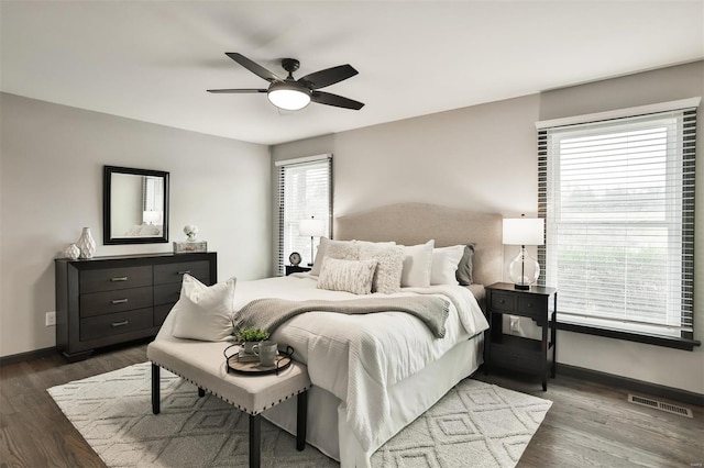 bedroom featuring ceiling fan and dark wood-type flooring