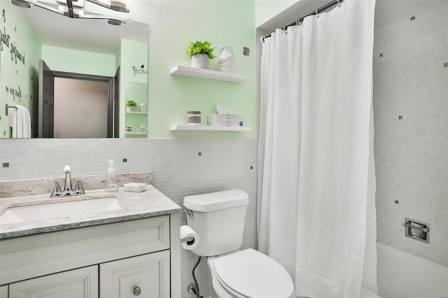 full bathroom featuring tasteful backsplash, toilet, shower / tub combo with curtain, vanity, and tile walls