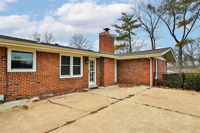 back of property with a patio area