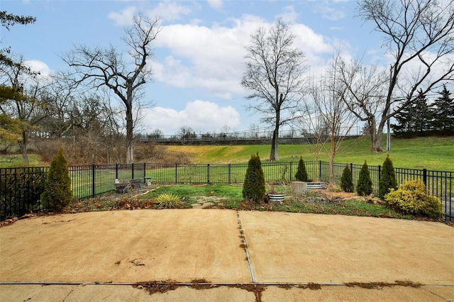 view of yard featuring a rural view and a patio area