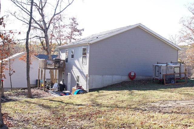 view of side of home featuring a yard