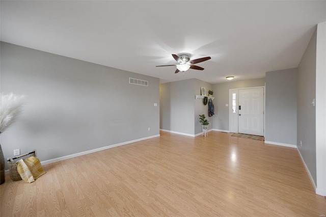 unfurnished room with ceiling fan and light hardwood / wood-style flooring