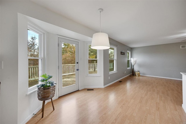 dining room with light hardwood / wood-style flooring