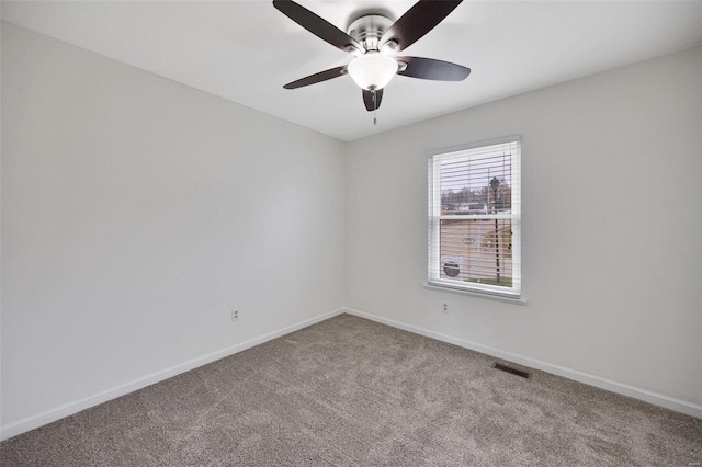 unfurnished room featuring ceiling fan and light colored carpet