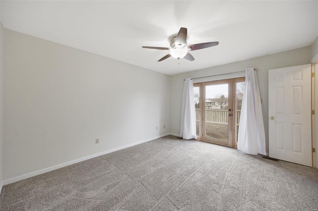 empty room with ceiling fan and carpet floors