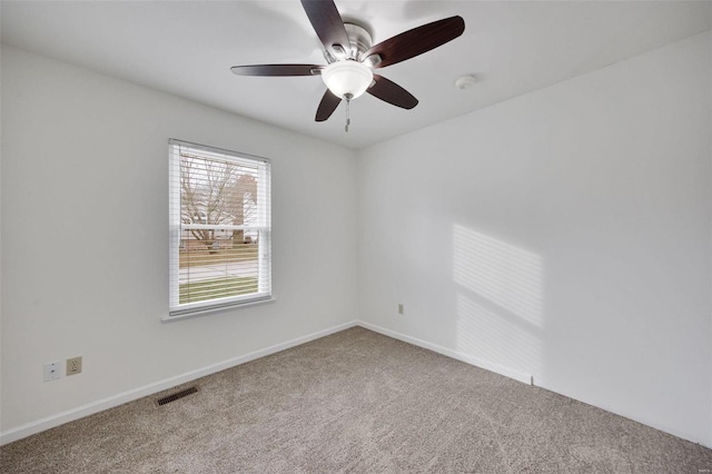 empty room featuring carpet flooring and ceiling fan