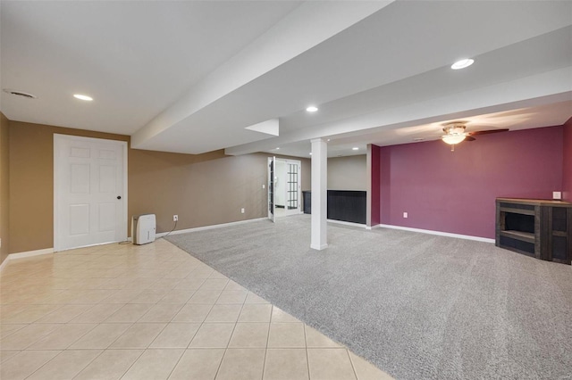 basement featuring light colored carpet