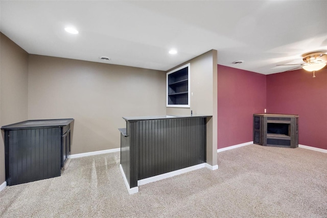 bar with ceiling fan and light carpet