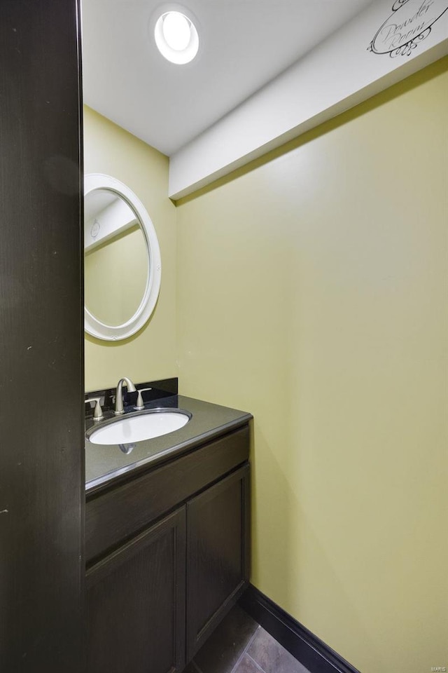 bathroom with tile patterned flooring and vanity