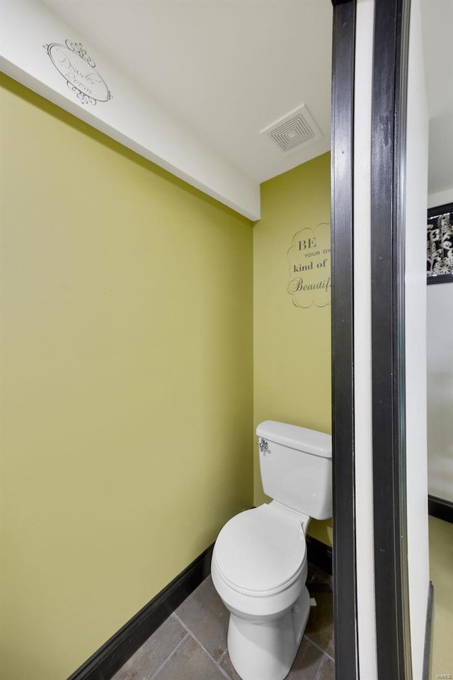 bathroom featuring tile patterned floors and toilet