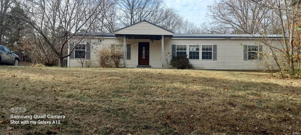 view of front of home with a front yard