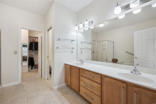 bathroom with vanity, tile patterned floors, and walk in shower