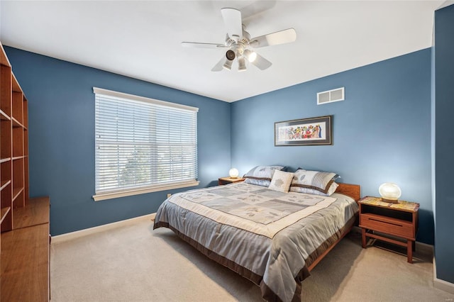 bedroom with light colored carpet and ceiling fan