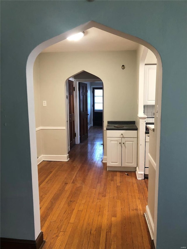 hall with wood-type flooring