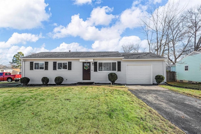 ranch-style home with a garage and a front lawn