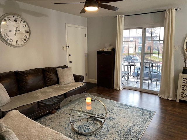 living room featuring dark hardwood / wood-style floors and ceiling fan