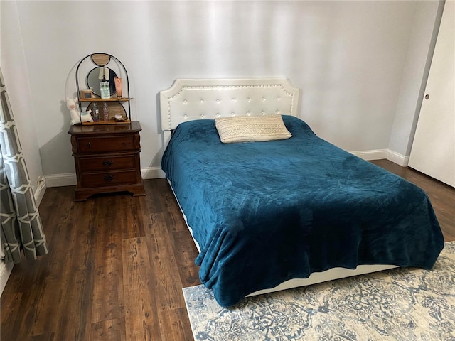 bedroom featuring dark hardwood / wood-style flooring