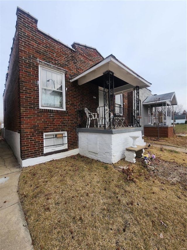 exterior space featuring a yard and covered porch