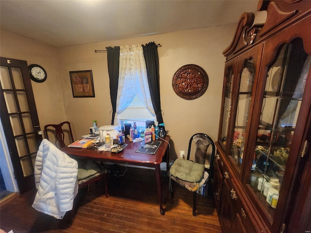 dining room with dark wood-type flooring