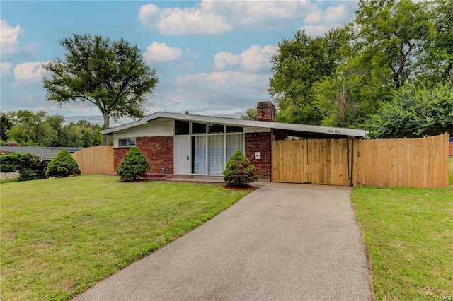 single story home with a front yard and a carport