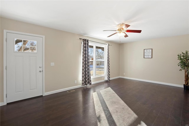 foyer featuring ceiling fan and dark hardwood / wood-style floors