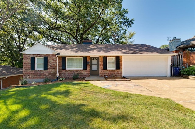 ranch-style home with a garage and a front lawn