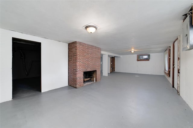 basement with a brick fireplace