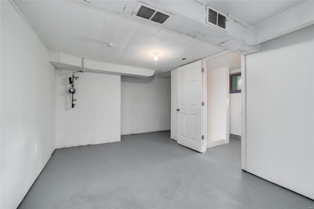 basement with a textured ceiling