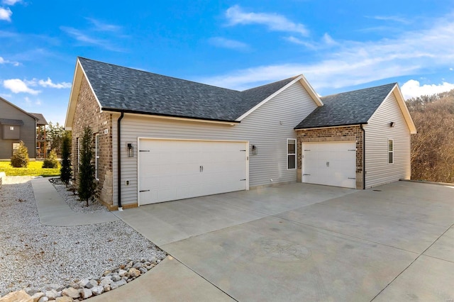 view of side of property with a garage