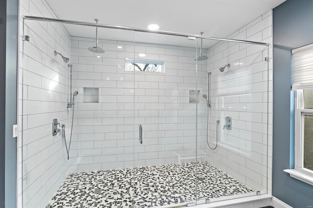 bathroom with a shower with shower door