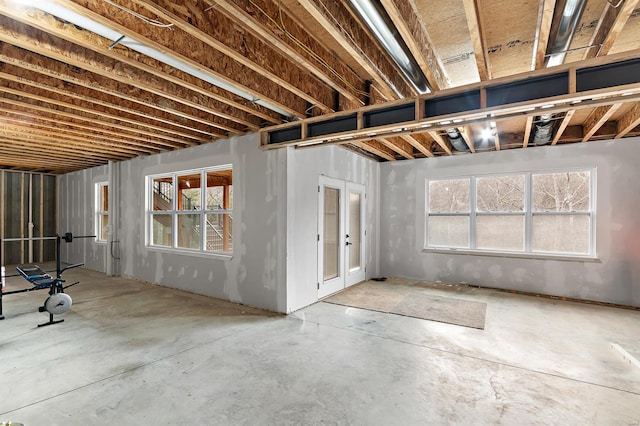 basement with plenty of natural light and french doors