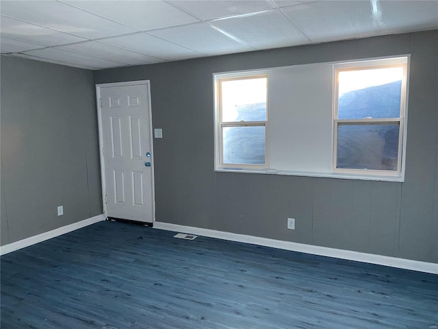 entrance foyer featuring a paneled ceiling and dark wood-type flooring